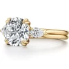 “Three-stone engagement ring featuring a lab-grown center diamond flanked by pear-shaped side stones in a double-prong setting, with a dual-row high-polished band—Ella Landon’s signature Marriah Ella design.”